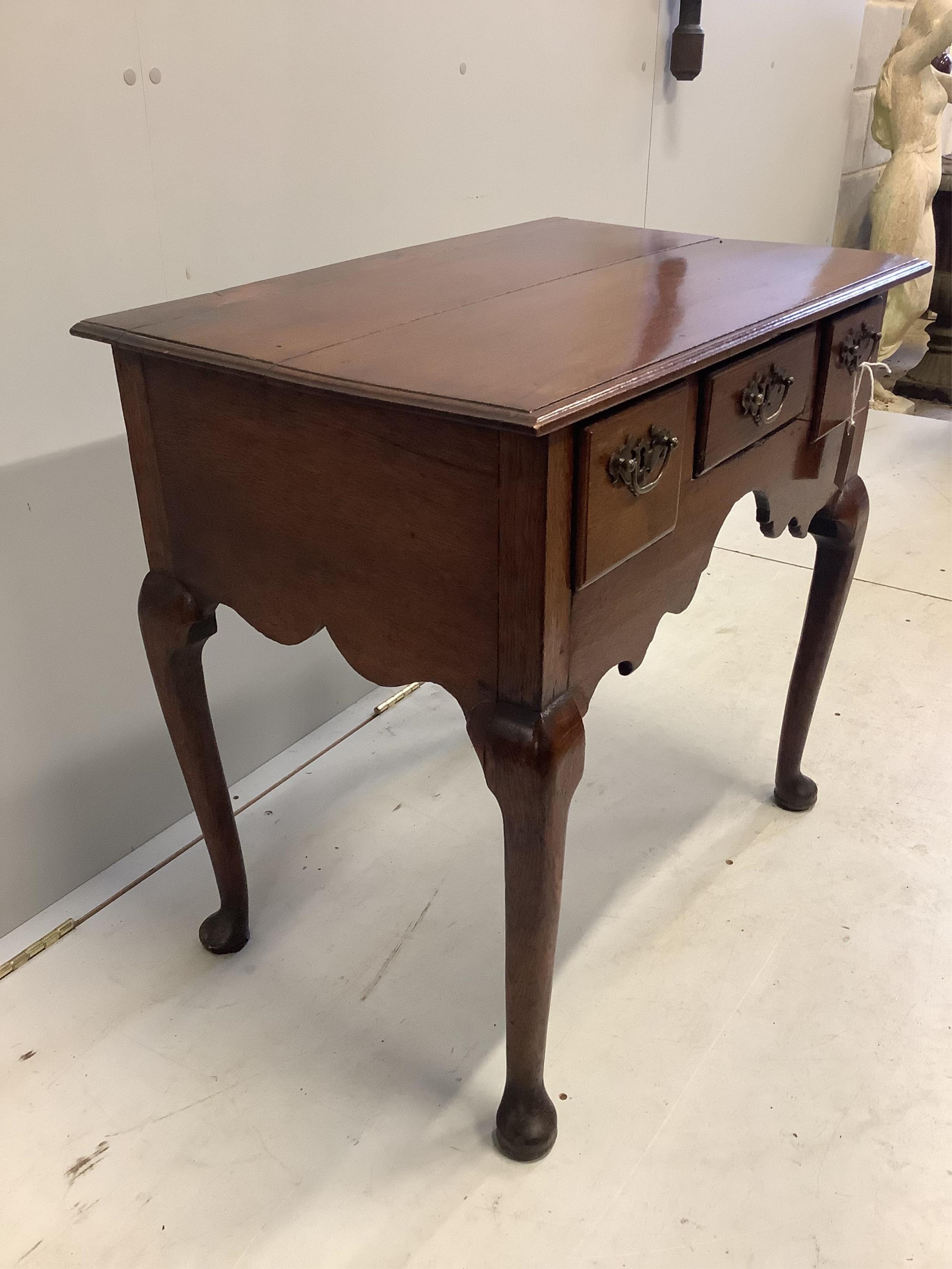 A George III and later oak lowboy, width 76cm, depth 48cm, height 72cm. Condition - fair